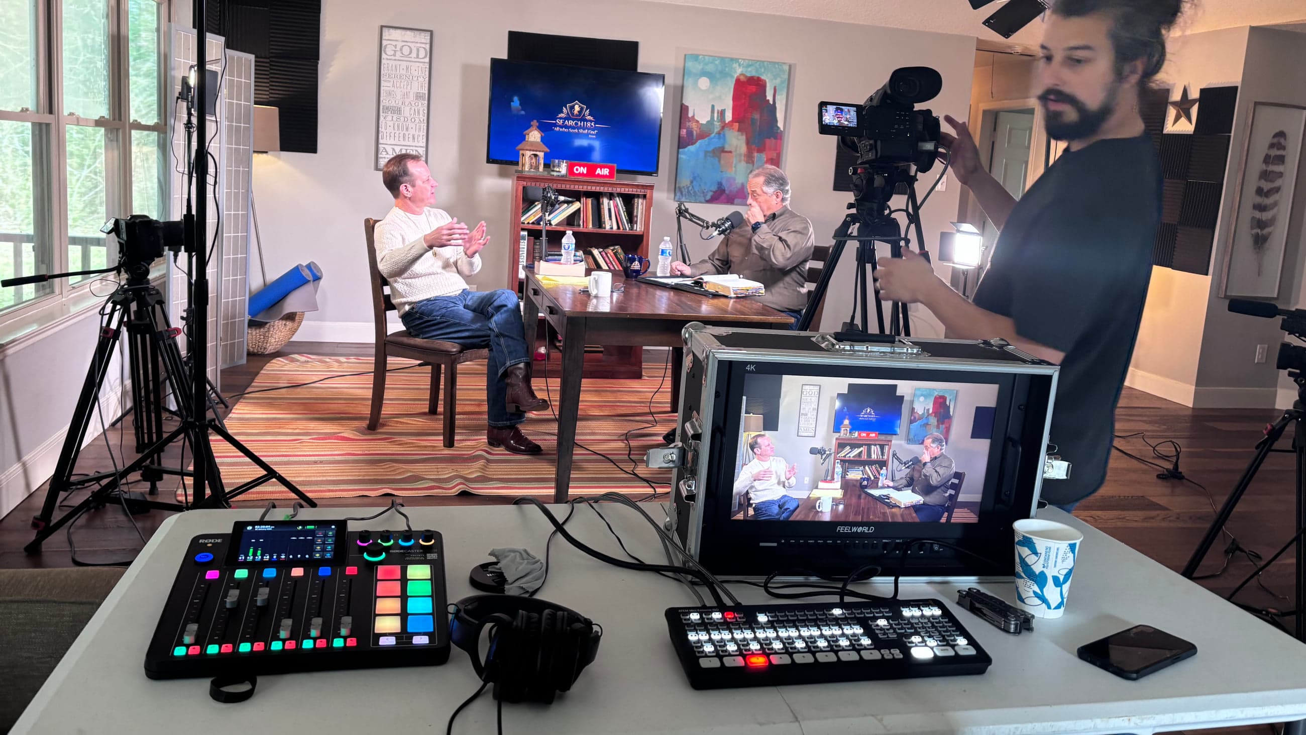 Nick Garza directing a full production setup with camera, lighting, switcher, and audio equipment during a Search185 interview